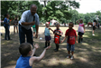 Young children participating in egg toss