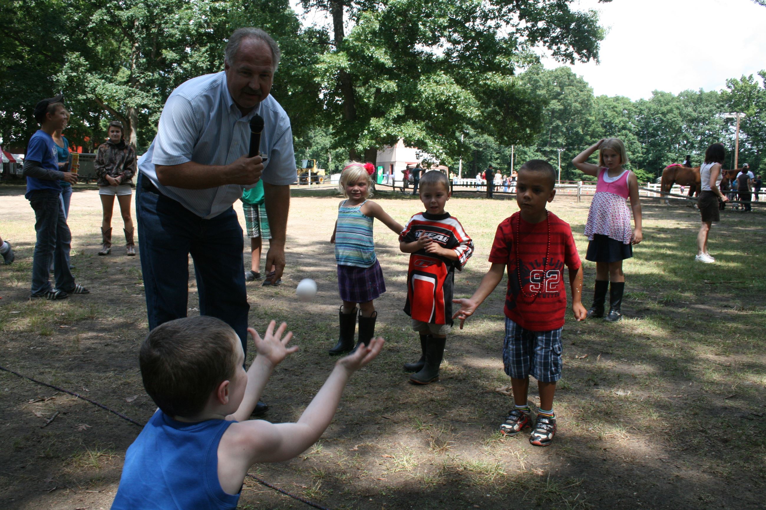 Young children participating in egg toss